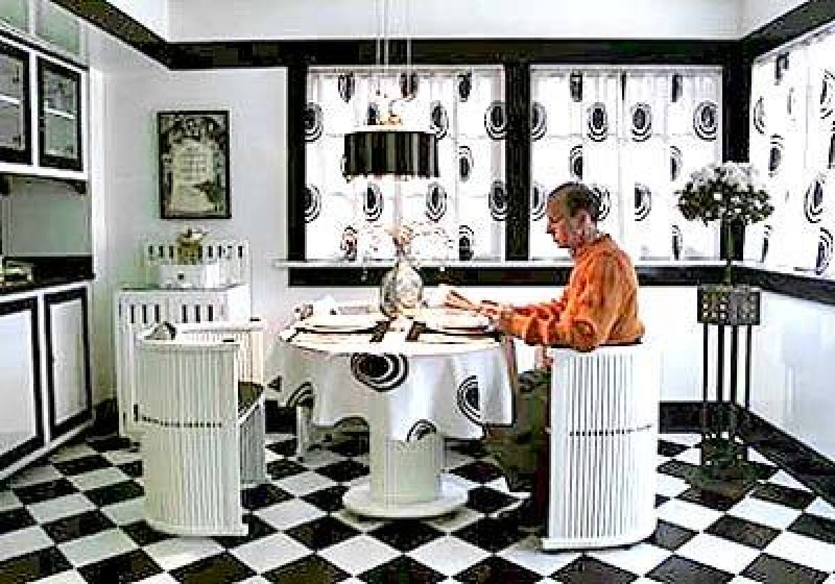 Black-and-white kitchens like Ron Bernsteins were typical of Vienna Secession. The table and chairs are circa 1910; linoleum squares were hand laid.