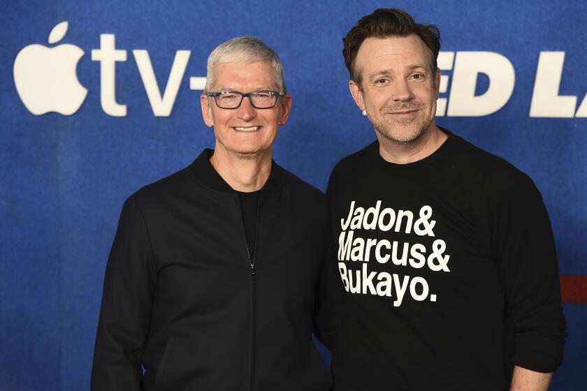 Tim Cook, left, and Jason Sudeikis arrive at the premiere of the second season of "Ted Lasso" on Thursday, July 15, 2021, at the Pacific Design Center. (Photo by Jordan Strauss/Invision/AP)
