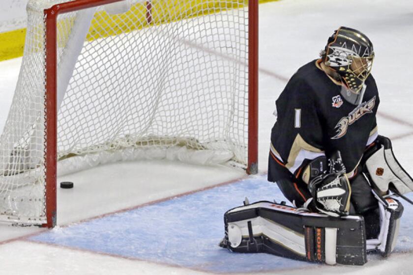Ducks goalie Jonas Hiller gives up a goal during Tuesday's 4-2 loss to the Minnesota Wild. The Ducks lead the NHL in points, but Coach Bruce Boudreau says the team has "to be a lot better."