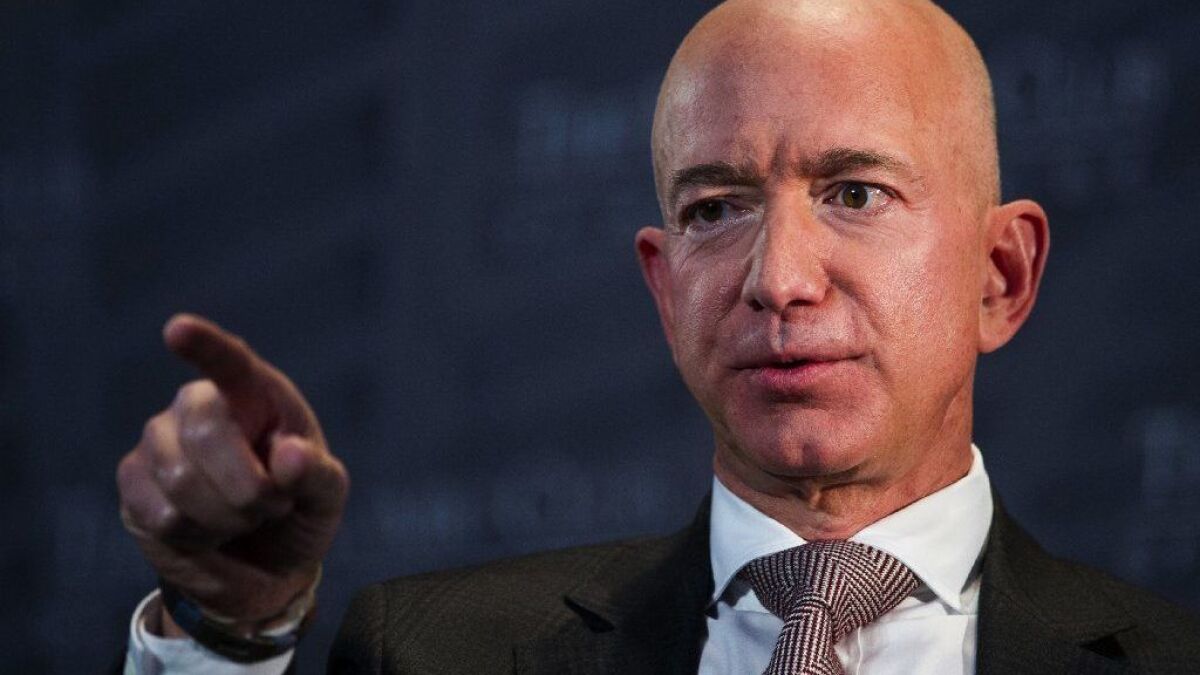 Amazon Chief Executive Jeff Bezos has accused the National Enquirer of threatening to publish intimate photos of him and former TV news anchor Lauren Sanchez unless he stopped an investigation into how it got his private messages.