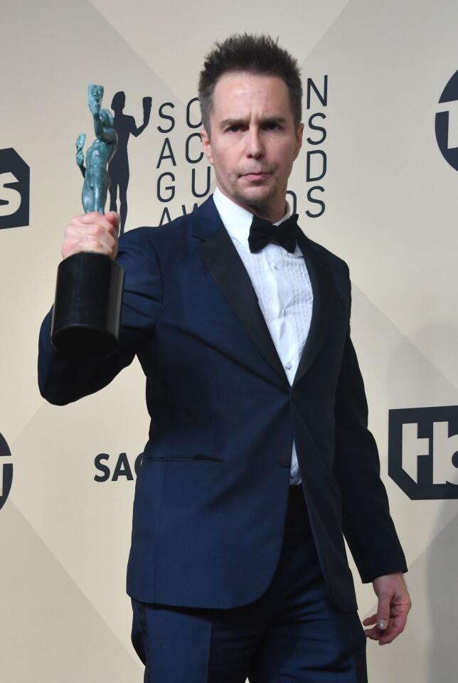 Sam Rockwell poses with the trophy for outstanding performance by a male actor in a supporting role in the press room at the 24th Annual Screen Actors Guild Awards at the Shrine Exposition Center on January 21, 2018 in Los Angeles, California.