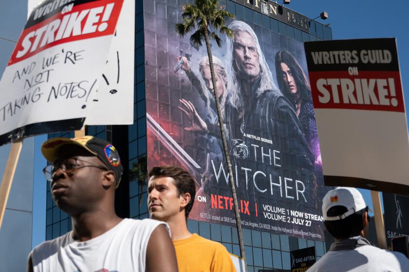 LOS ANGELES, CA - JULY 14: SAG-AFTRA members take to the picket line outside Netflix in Los Angeles, CA on Friday, July 14, 2023. Actors join striking writers who have been on the picket lines since the beginning of May. (Myung J. Chun / Los Angeles Times)