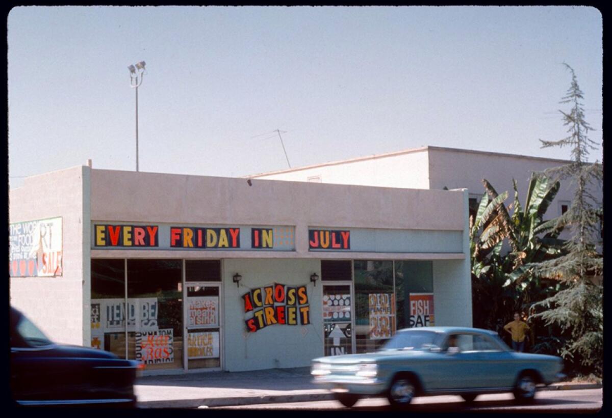 A 1960s image shows a car driving past a storefront covered in bright prints and a sign that reads "Every Friday in July"