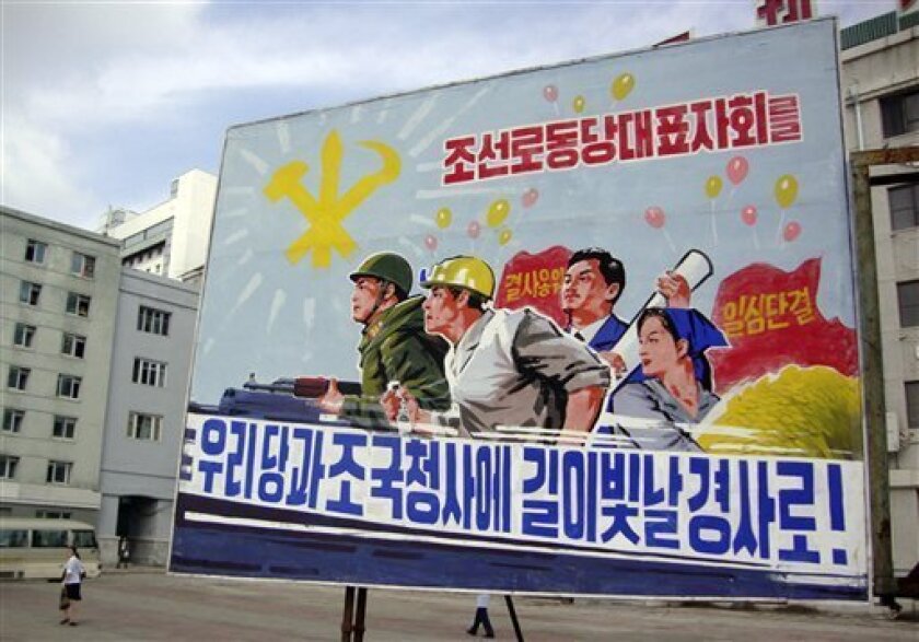 A large campaign poster is posted in a street, promoting a Workers' Party conference early this month in Pyongyang, North Korea, Monday, Sept. 6, 2010. North Korea's ruling communist party members gathered in Pyongyang ahead of their largest political conference in 30 years, state media reported Monday, amid predictions that leader Kim Jong Il would use the meeting to give a key ruling party position to one of his sons. The campaign slogans in the poster reads: "Let us mark the representatives' meeting of the Workers' Party of Korea as a celebration that will shine in the history of our party and our country." (AP Photo/APTN)