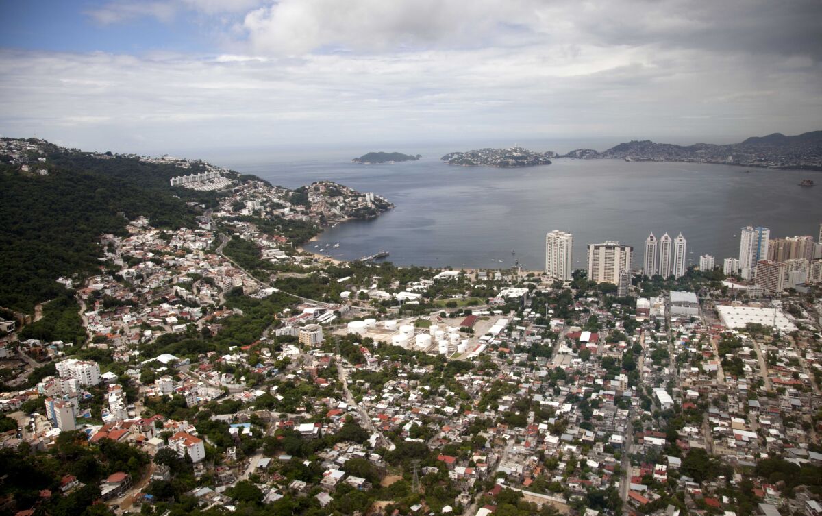 FILE - This Sept. 20, 2013 file photo shows an aerial view of the Pacific resort city of Acapulco, Mexico. The Mexican coastal city pulled a pair of controversial video ads Thursday, Aug. 6, 2020, touting the faded resort’s reputation as an “anything goes” tourism destination because they weren't appropriate during the new coronavirus pandemic. (AP Photo/Eduardo Verdugo, File)