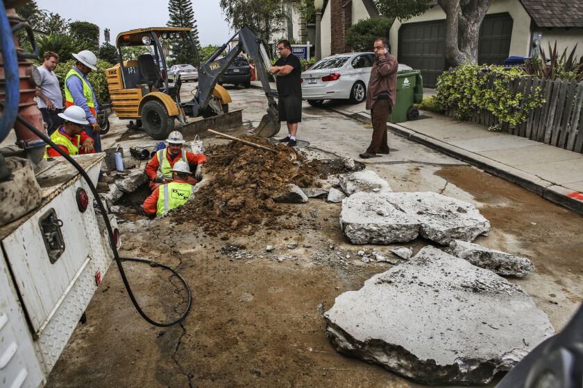 DWP workers repair a water main break in Loz Feliz in June. The proposed rate hikes have been pitched as necessary to cover the cost of overdue infrastructure repair, as well as to help pay for newer, renewable sources of energy.