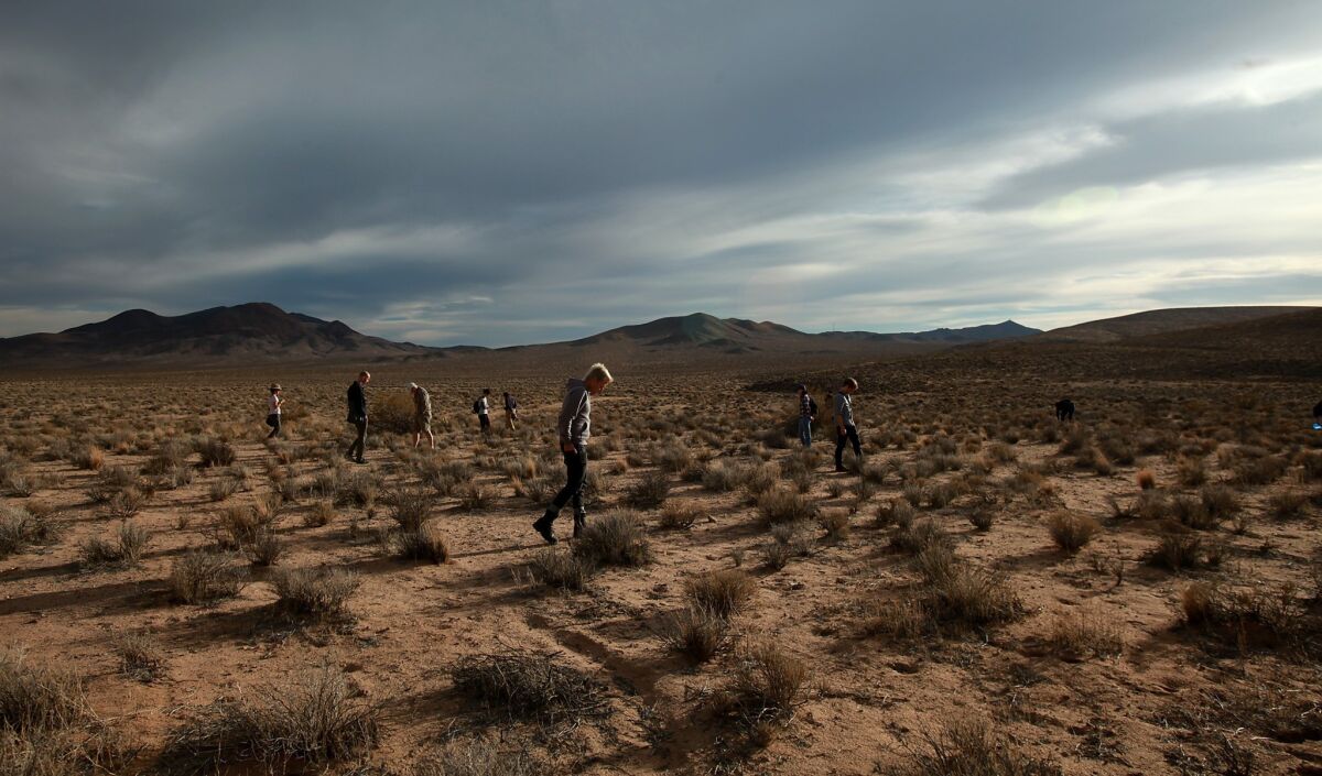 Tourists scour the Mojave Desert landscape on the lookout for debris from a 1967 X-15 crash near Johannesburg.
