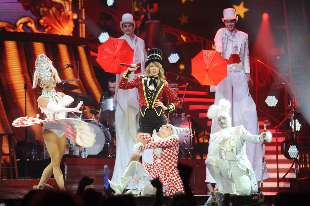 Seven-time Grammy winner Taylor Swift, shown performing in London's O2 Arena in February, out-earned all other musicians in 2013, according to Billboard.