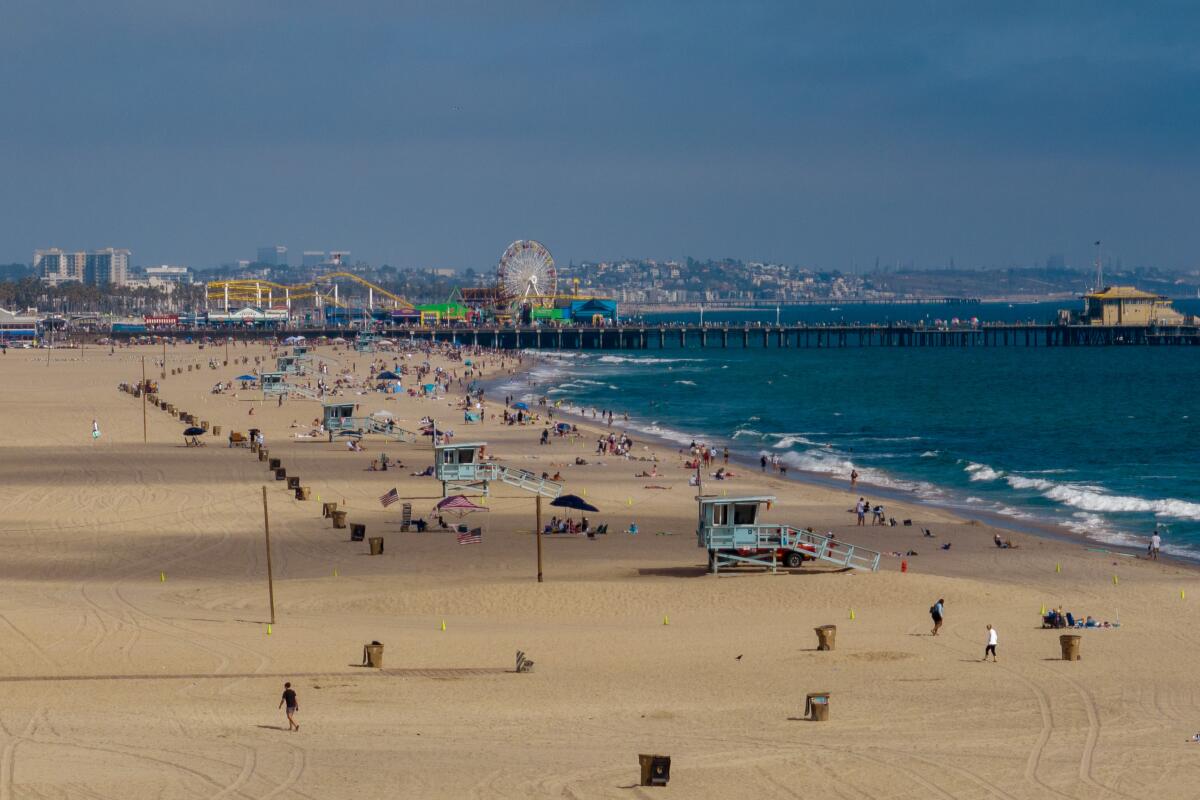 The sand around the Santa Monica Pier will be packed this weekend as high pressure 