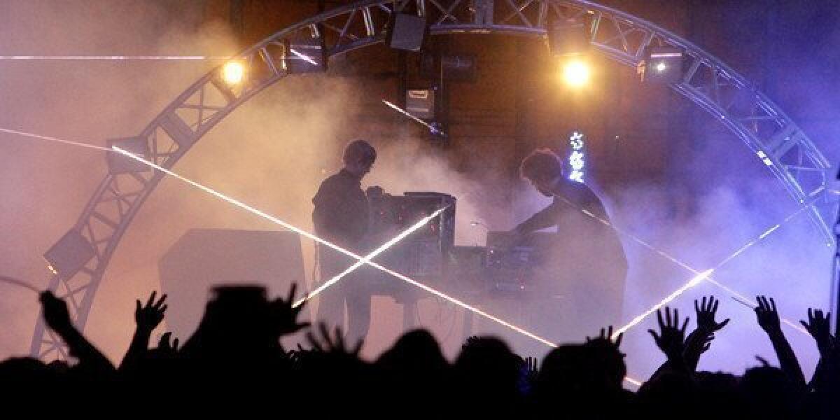 Jas Shaw, left, and James Ford of the electronic music duo Simian Mobile Disco perform on the first day of FYF Fest.