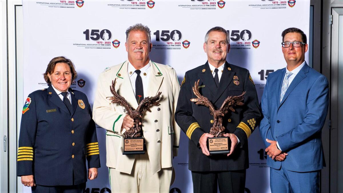 Chief Brian Fennessy, third from left, poses with his IAFC Chief of the Year Award.