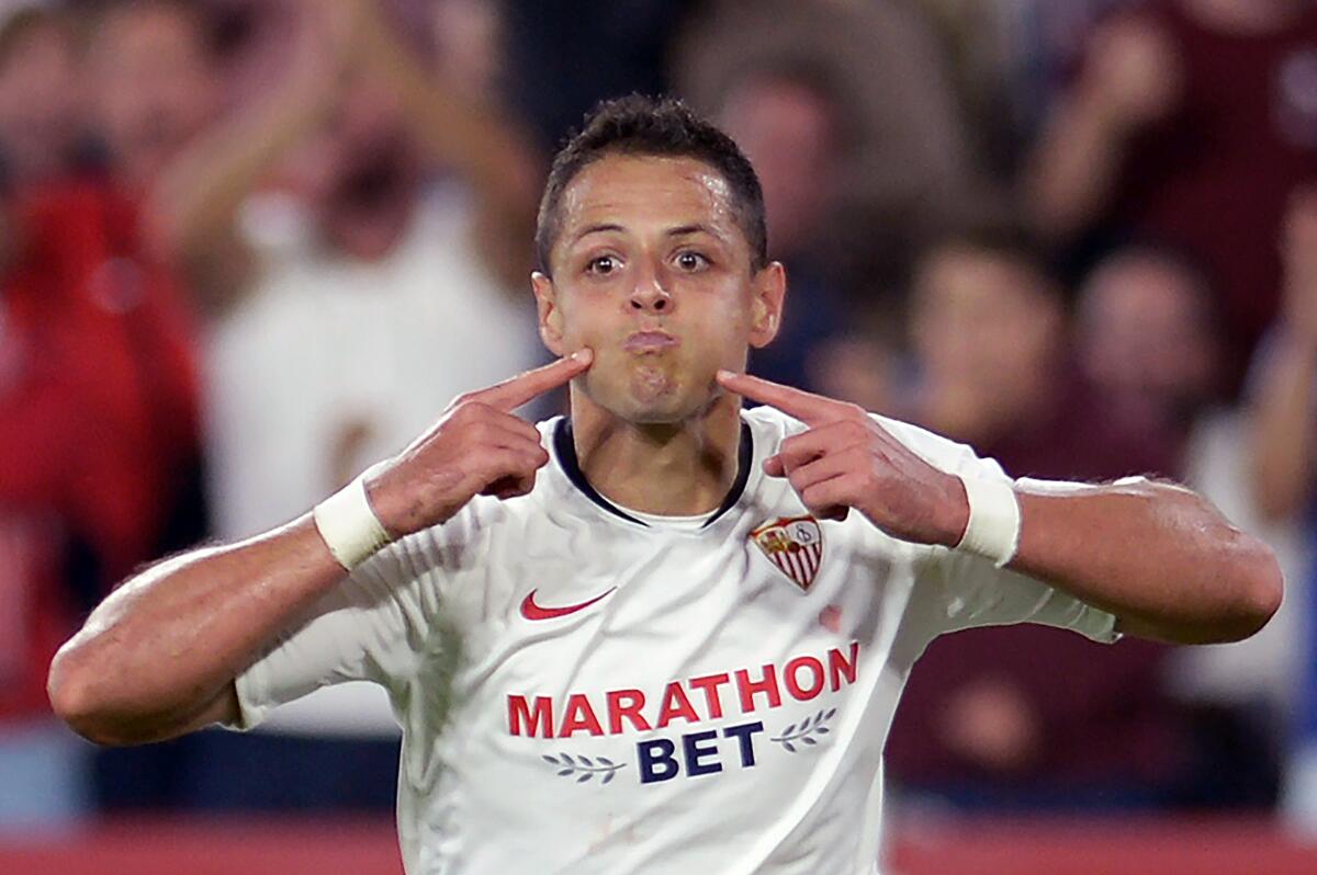 Sevilla's Mexican forward Chicharito celebrates after scoring a goal during the Spanish league football match between Sevilla FC and Getafe CF at the Ramon Sanchez Pizjuan stadium in Seville on October 27, 2019. (Photo by CRISTINA QUICLER / AFP) (Photo by CRISTINA QUICLER/AFP via Getty Images) ** OUTS - ELSENT, FPG, CM - OUTS * NM, PH, VA if sourced by CT, LA or MoD **