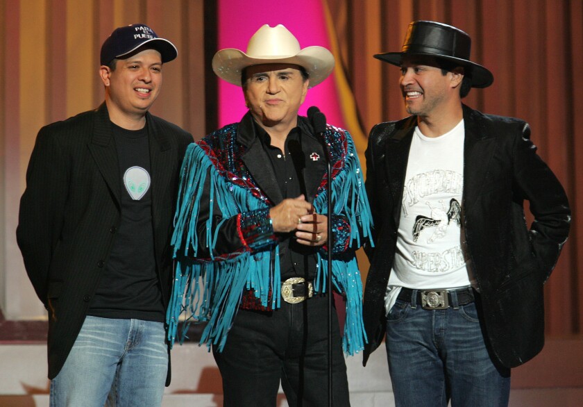  Johnny Canales with two members of La Mafia band at the 2005 Billboard Latin Music Awards.