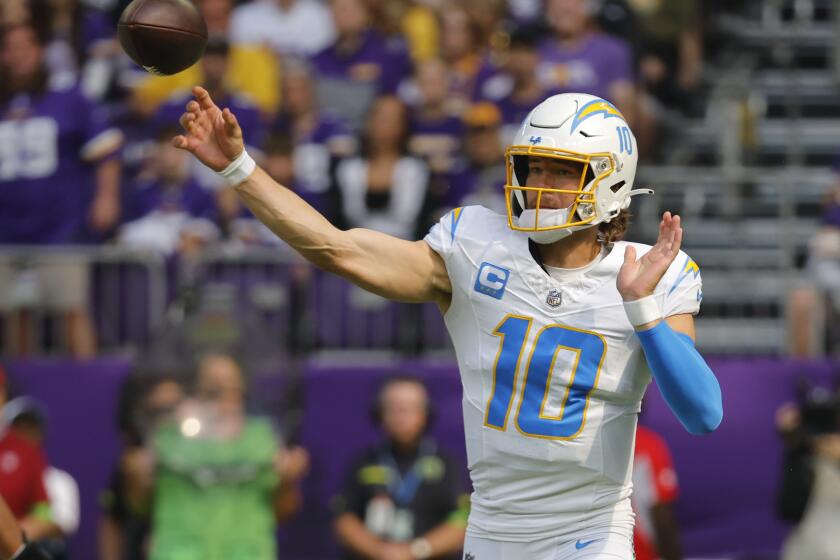 Los Angeles Chargers quarterback Justin Herbert (10) throws a pass during the first half of an NFL football game against the Minnesota Vikings, Sunday, Sept. 24, 2023, in Minneapolis. (AP Photo/Bruce Kluckhohn)