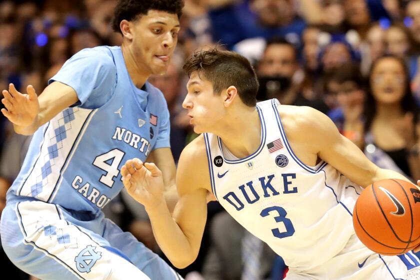 Duke guard Grayson Allen drives to the basket against North Carolina forward Justin Jackson during their game Thursday night.