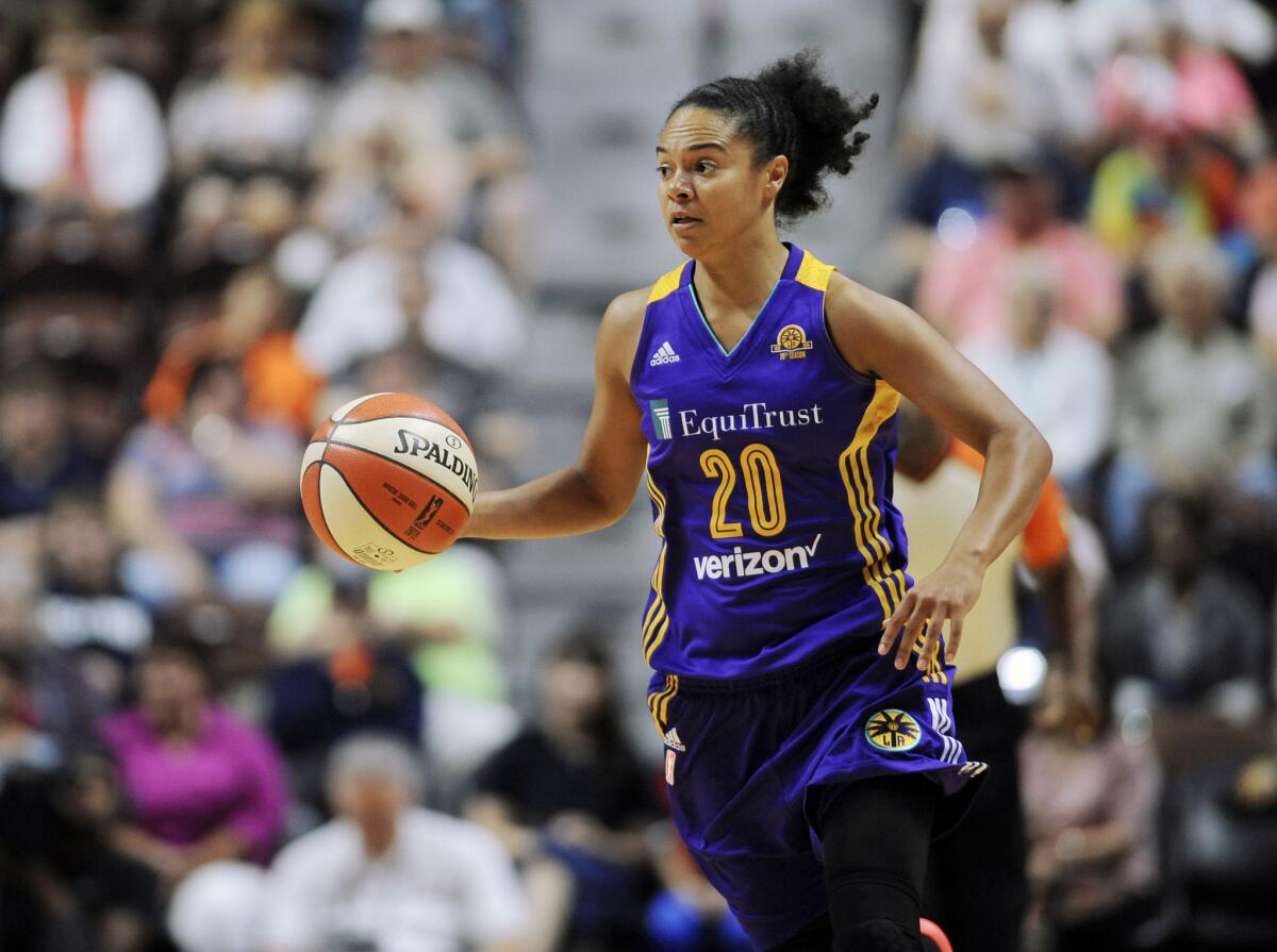 Sparks guard Kristi Toliver brings the ball up the court during a game in 2016.