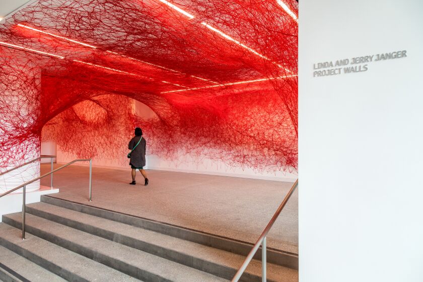 LOS ANGELES, CA - MARCH 23, 2023 - Artist Chiharu Shiota installation, The Network, made with red yarn is on display. In the new lobby are at the Hammer Museum, March 23, Los Angeles, CA . (Ricardo DeAratanha / Los Angeles Times)