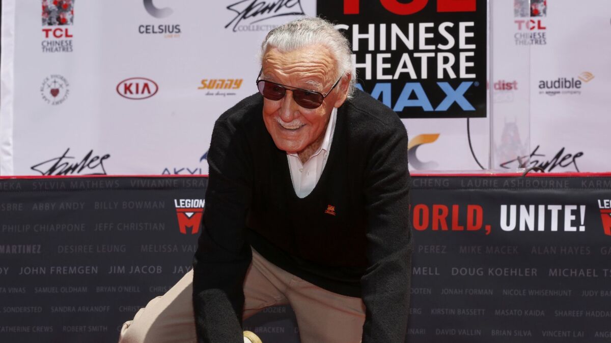 Stan Lee, the iconic creator and legend of Marvel Comics, puts his handprints and footprints in cement at the TCL Chinese Theatre IMAX on July 18, 2017.