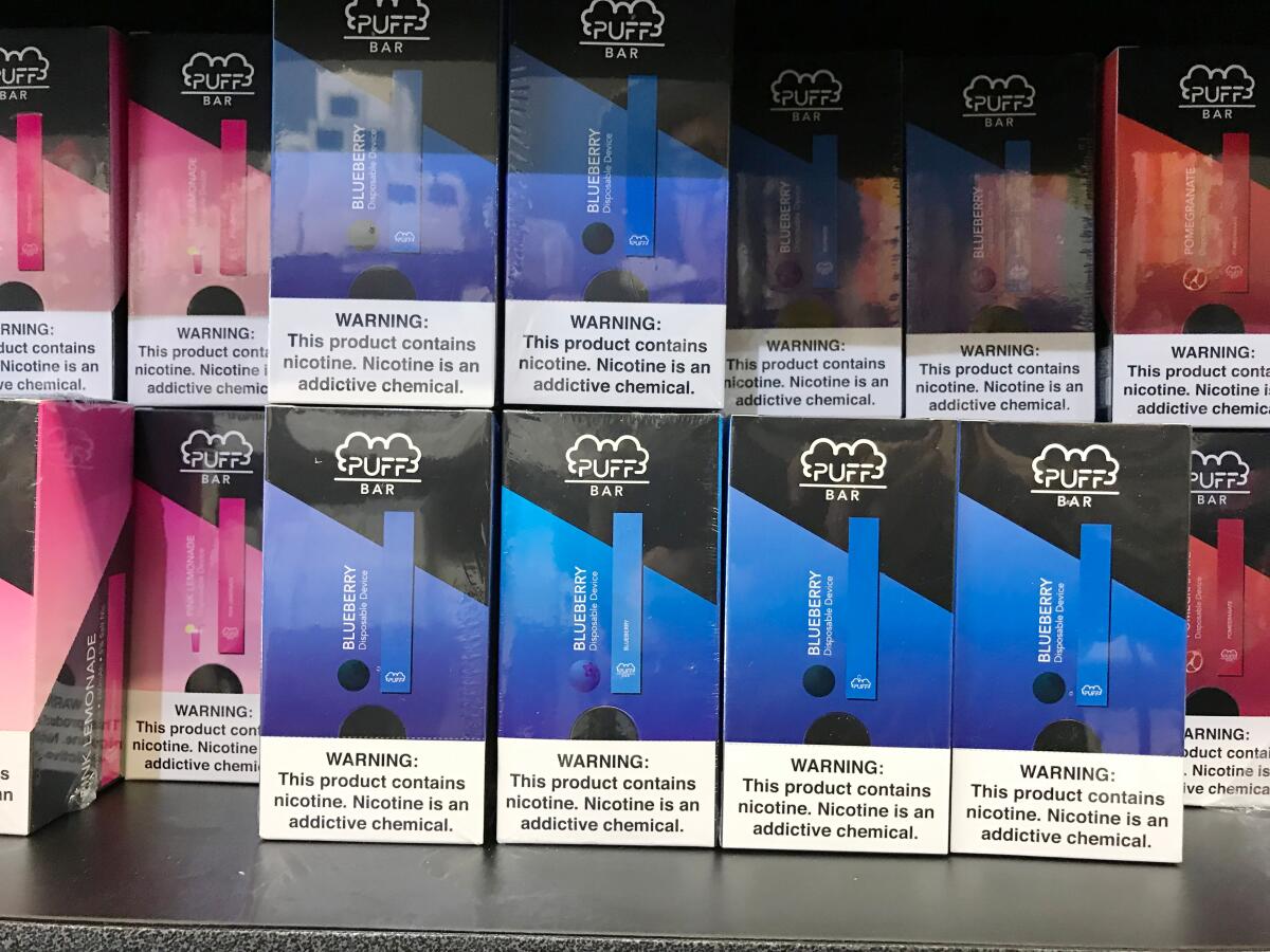 Flavored vaping products containing nicotine in a store display in Los Angeles. The L.A. Unified School District has sued vaping giant Juul, which has touted its steps to minimize the risk of its products.