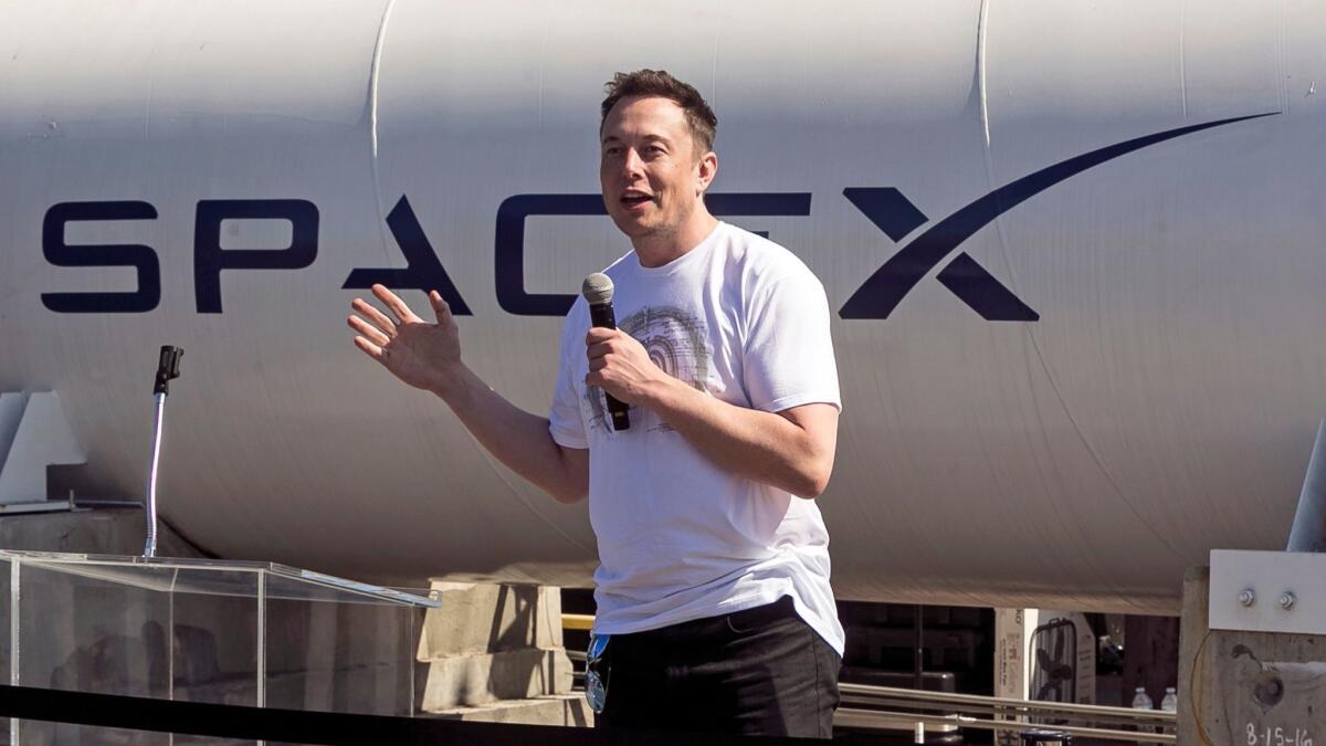 CEO Elon Musk speaks at SpaceX headquarters in Hawthorne. Musk has lashed out at journalists over recent criticism of operations at his electric car company, Tesla Inc.
