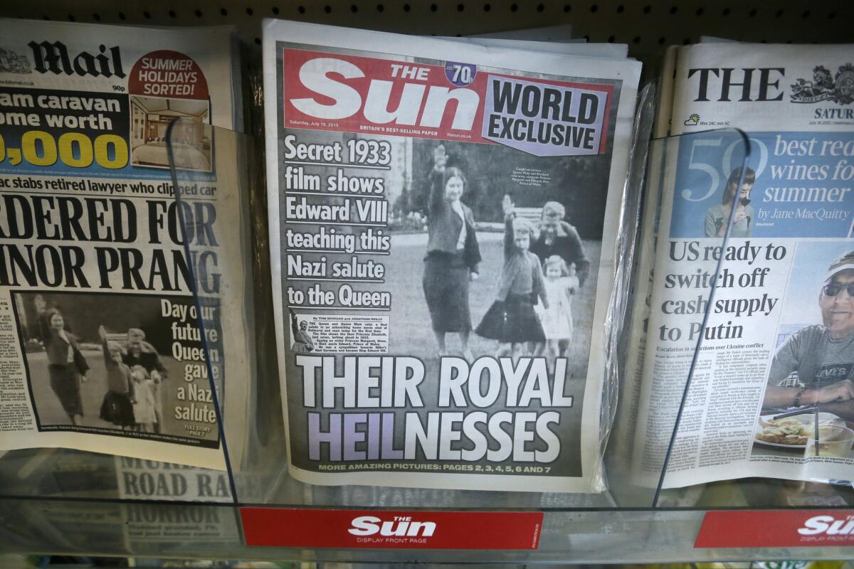 Newspapers in London display a photo of Queen Elizabeth as a child giving a Nazi salute.