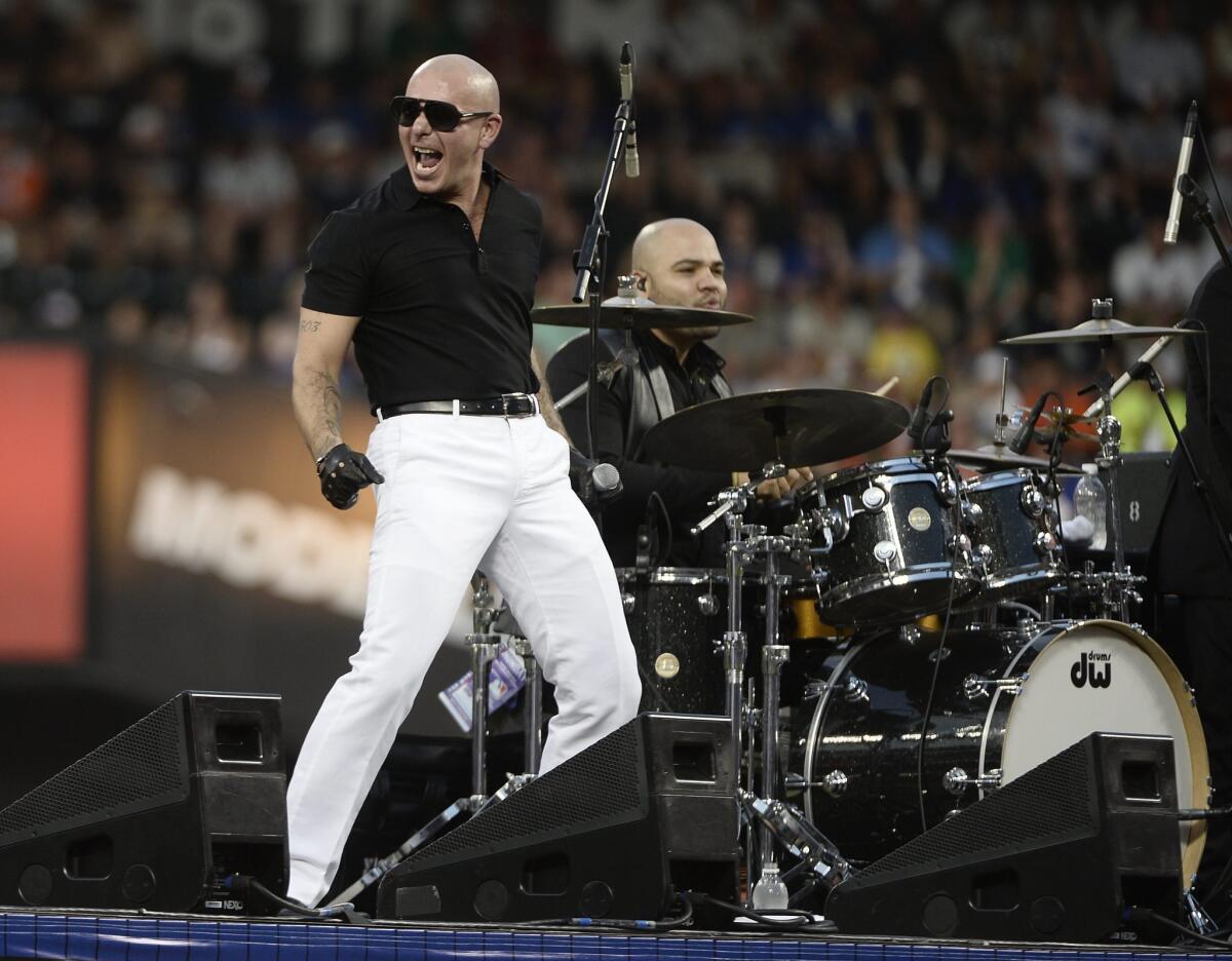 Pitbull, shown performing during baseball All-Star game activities in New York in July, was a popular ticket for California state officials seeking free entrance to concerts.