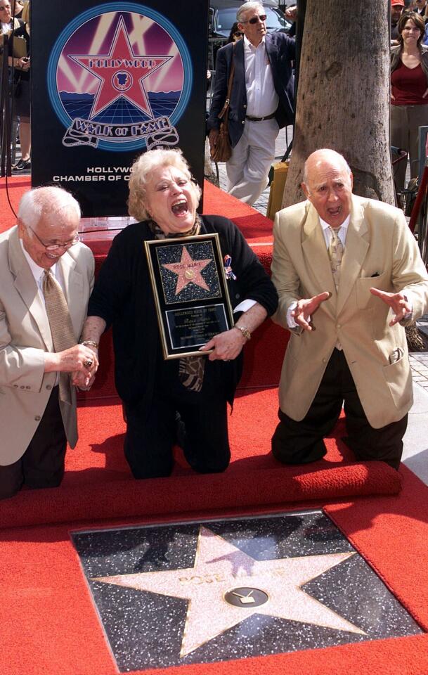Actress/singer Rose Marie is gleeful as director Carl Reiner, right, and Honorary Mayor of Hollywood Johnny Grant, present her with 2,184th star on the famed Hollywood Walk of Fame Oct. 3, 2001, in the Hollywood section of Los Angeles. Marie died Dec. 28, 2017, at age 94. Read more.