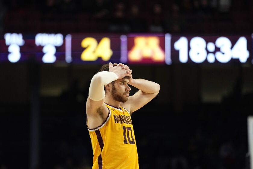 Minnesota forward Jamison Battle (10) reacts after a foul call during the second half of an NCAA college basketball game against Maryland, Saturday, Feb. 4, 2023, in Minneapolis. (AP Photo/Abbie Parr)