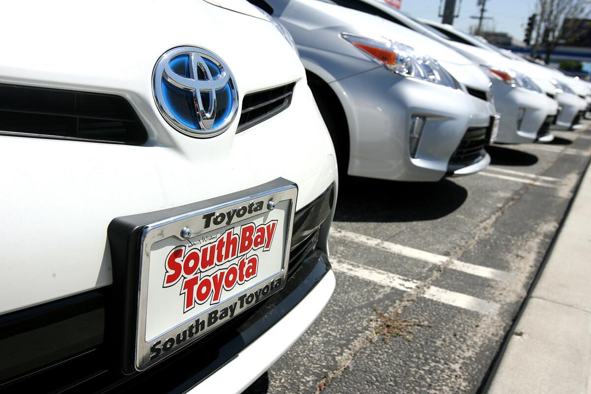 A row of new Toyota Priuses parked across the street from Toyota's U.S. headquarters in Torrance on Monday.