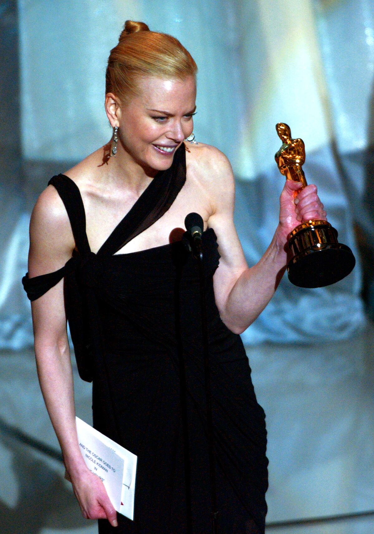 Actress Nicole Kidman reacts as she accepts the Oscar for best actress at the 75th Academy Awards.