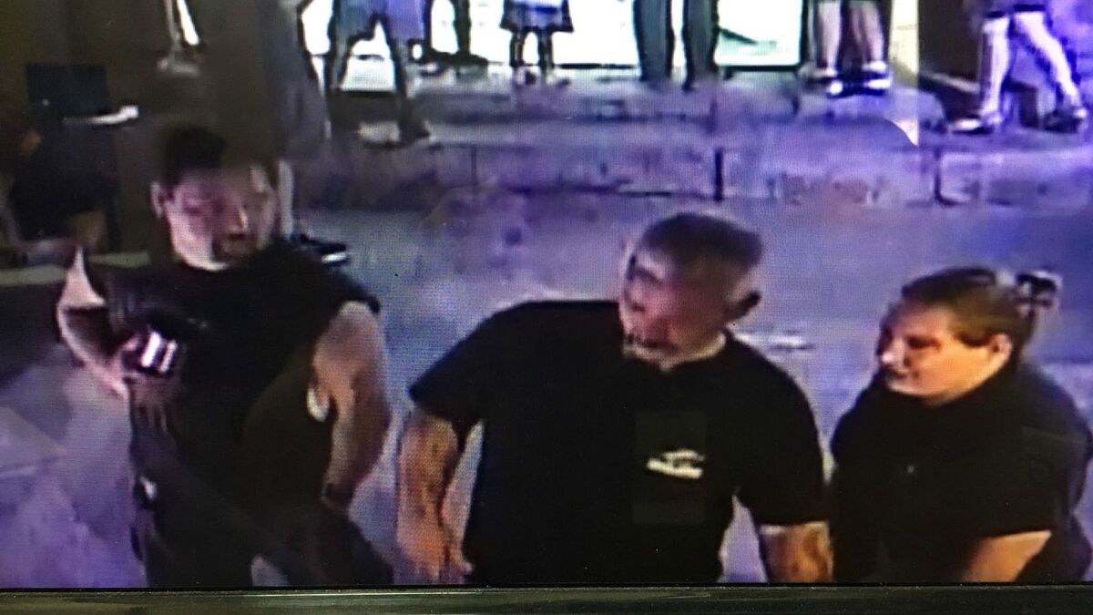 A frame grab released by the San Antonio Aquarium shows three suspects in the theft of a horn shark from an interactive exhibit.