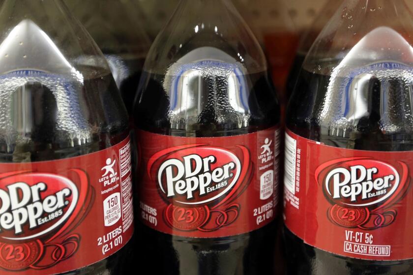 FILE - This April 28, 2016, file photo shows bottles of Dr. Pepper on a store shelf at Quality Cash Market in Concord, N.H. Keurig is buying Dr. Pepper Snapple Group Inc. to create a beverage business with approximately $11 billion in annual sales, announced Monday, Jan. 29, 2018. (AP Photo/Jim Cole, File)