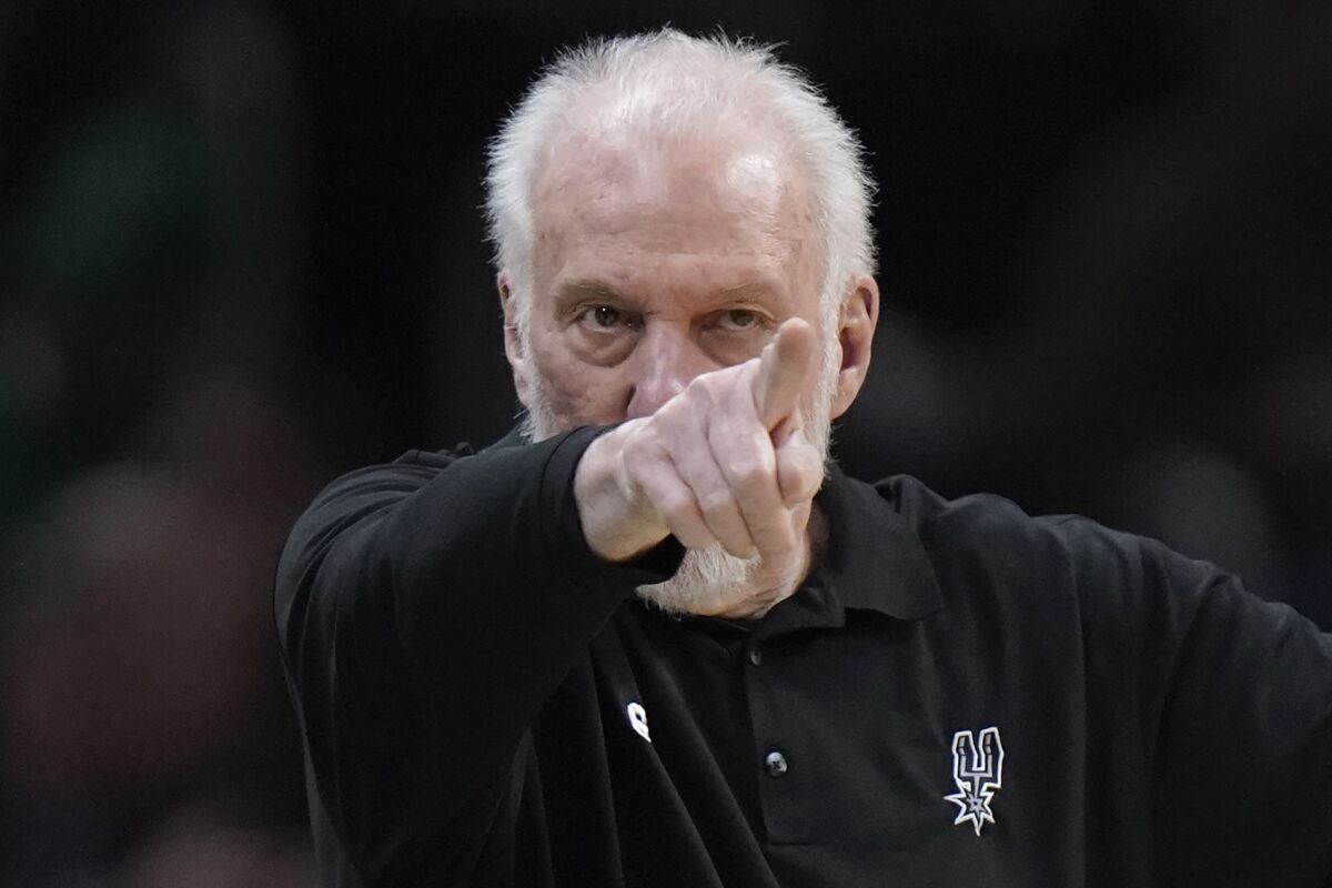 San Antonio Spurs head coach Gregg Popovich points from the bench in the second half of an NBA basketball game against the Boston Celtics, Sunday, March 26, 2023, in Boston. (AP Photo/Steven Senne)