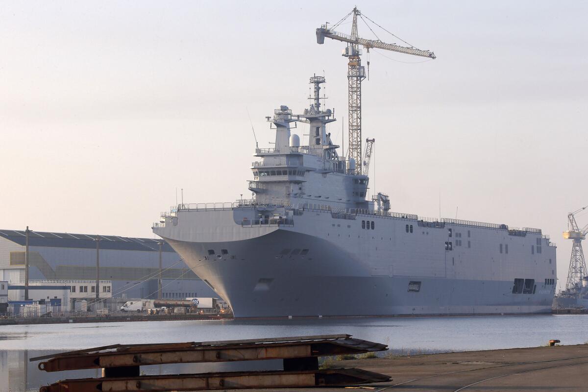 In this 2014 photo, the Vladivostok warship, the first of two Mistral-class helicopter carriers ordered by Russia, docks on the port of Saint-Nazaire, western France.