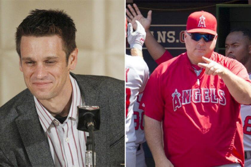 Angels General Manager Jerry Dipoto, left, and Manager Mike Scioscia could return to their roles with the organization next season despite the team's disappointing 78-84 season, finishing out of the playoffs for the fourth consecutive year.