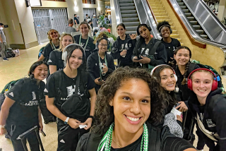 Hawaii women's volleyball player Mylana Byrd and her teammates pose for a selfie in an airport