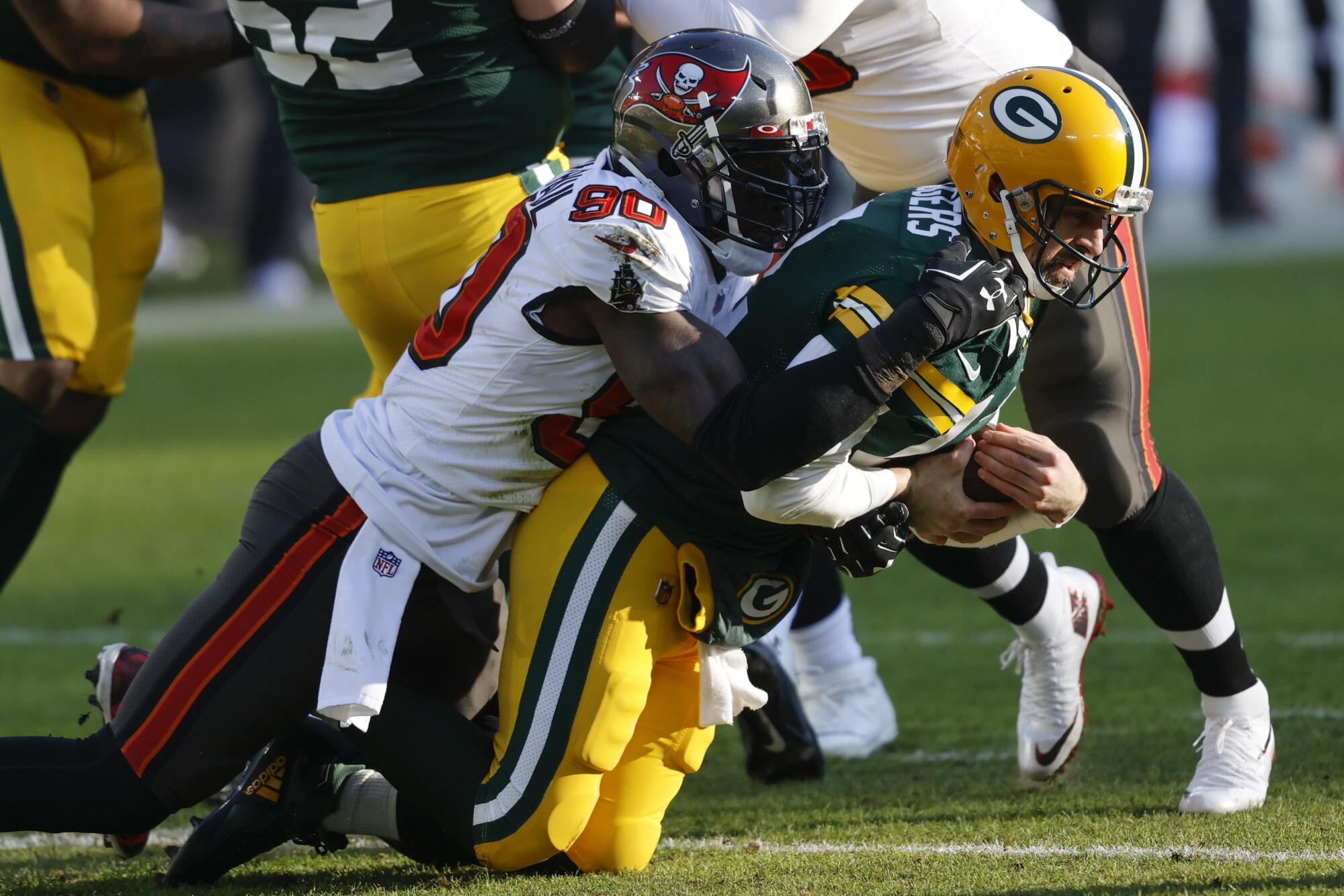 Tampa Bay Buccaneers' Shaquil Barrett (58) sacks Green Bay Packers quarterback Aaron Rodgers.