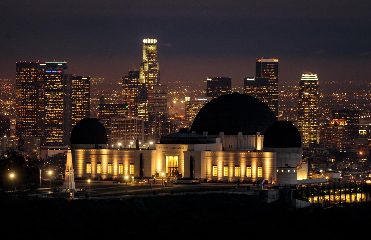 A view of the Griffith Observatory with downtown Los Angeles in the background.