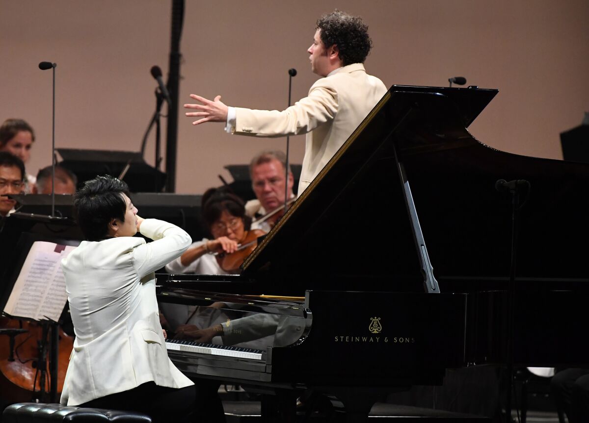 Pianist Lang and conductor Gustavo Dudamel perform Tchaikvosky's First Piano Concerto with the Los Angeles Philharmonic at the Hollywood Bowl Tuesday night.