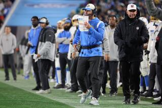 Chargers head coach Brandon Staley calls a defensive play.