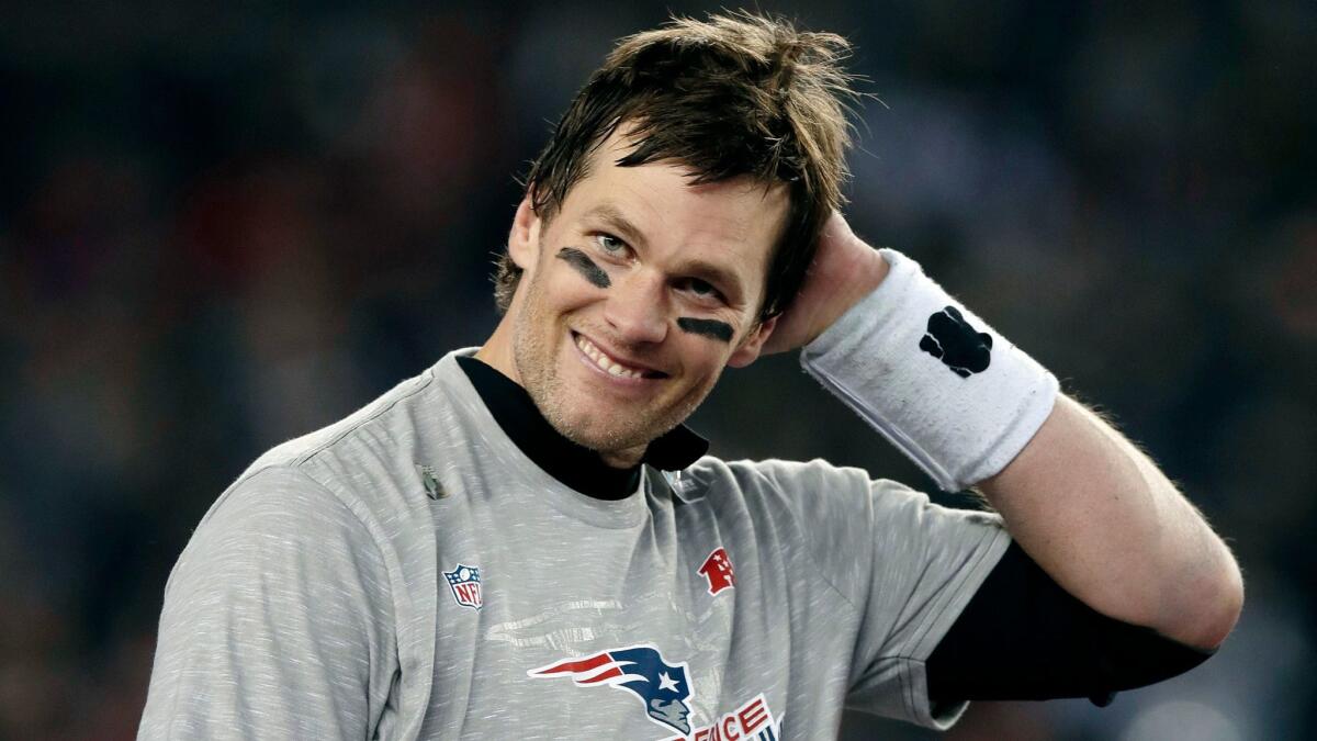 New England Patriots quarterback Tom Brady smiles after winning the AFC championship NFL football game 24-20 over the Jacksonville Jaguars on Sunday,