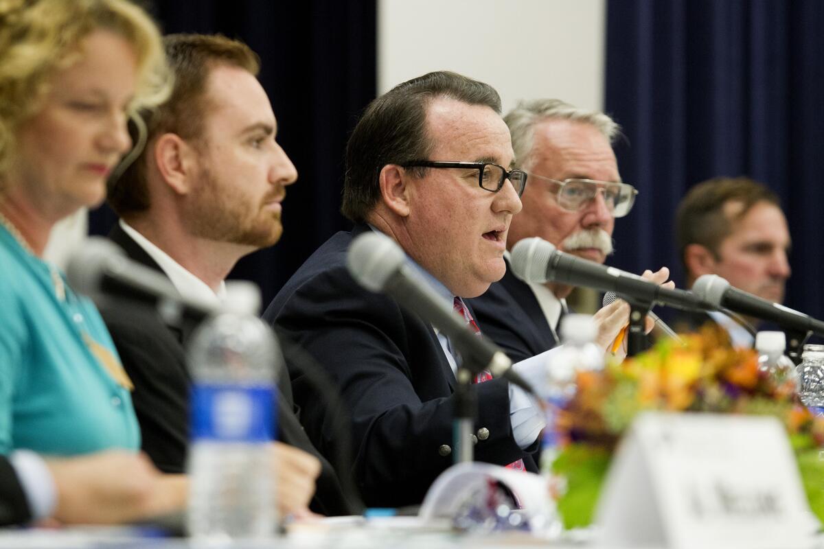 City Council candidates, from left, Katrina Foley, Tony Capitelli, Mayor Jim Righeimer, Jay Humphrey and Christopher Bunyan gather at an Oct. 2 forum at the Neighborhood Community Center in Costa Mesa.