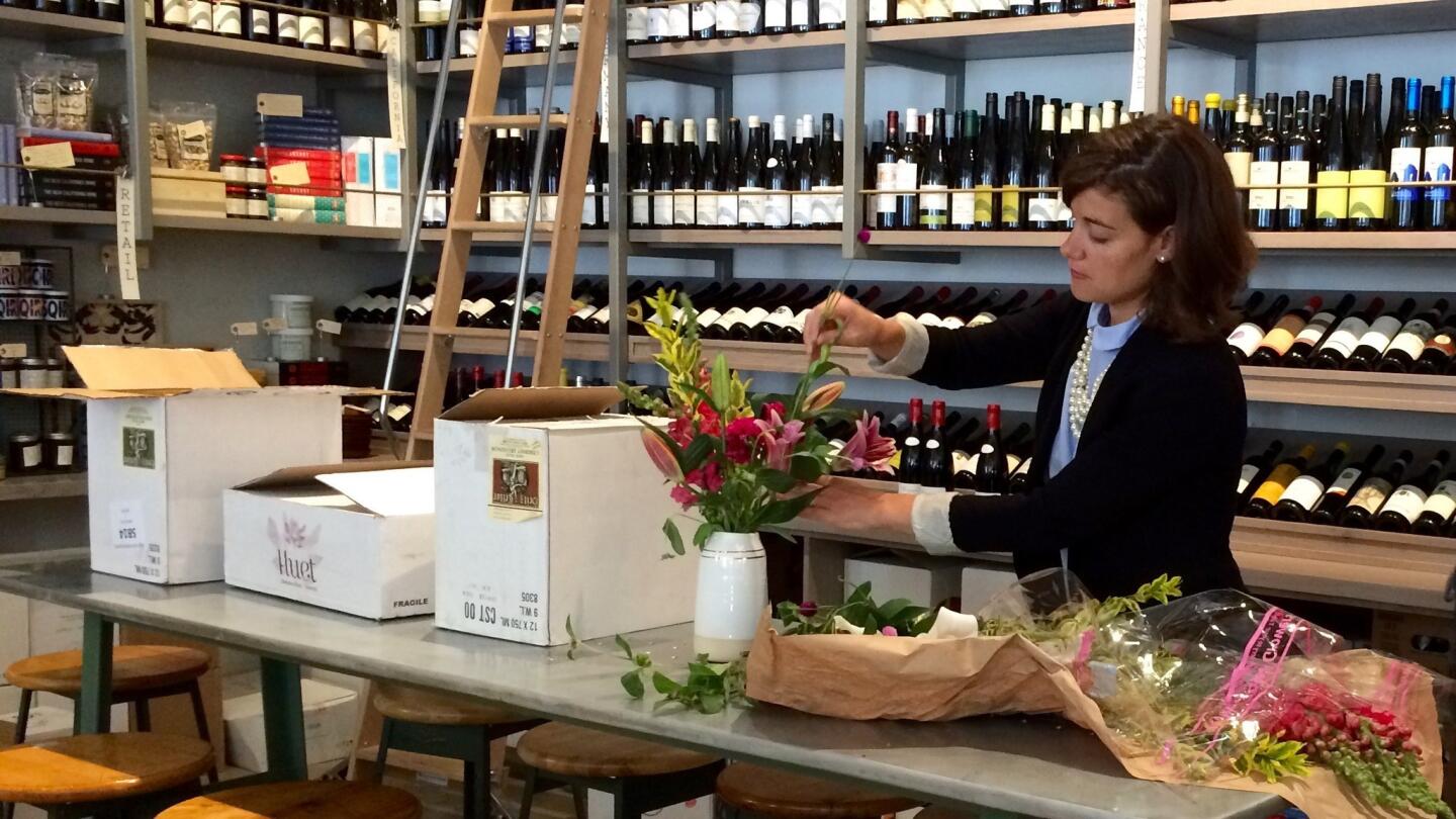 Kathryn Coker arranging flowers at Esters in Santa Monica