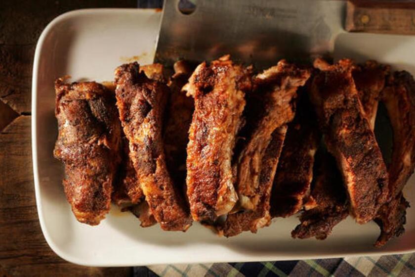 Tender baby back ribs are rubbed with a lightly sweet/lightly spicy dry rub and then smoked with hickory.