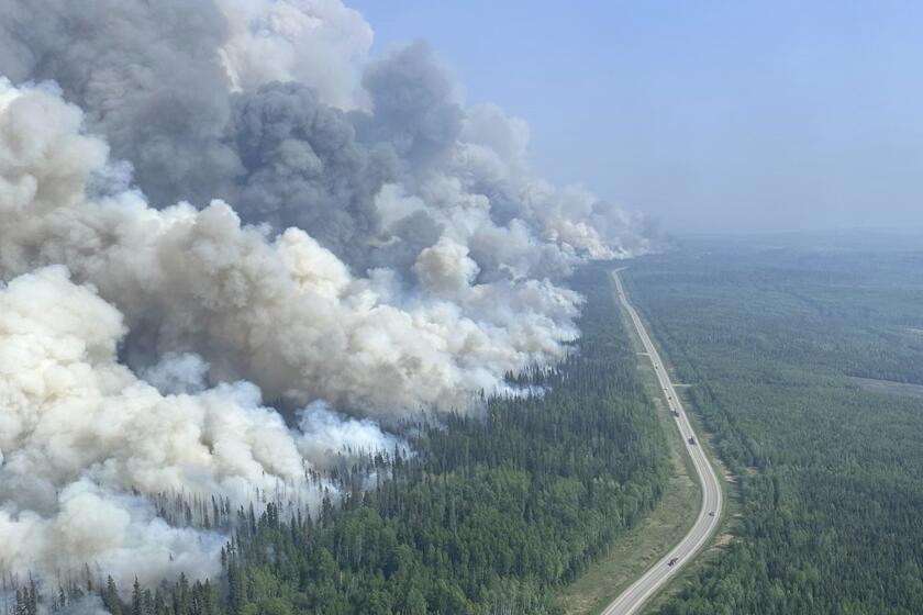 In this photo released by the British Columbia Wildfire Service, a 2,000 hectares planned ignition is successfully completed on the Stoddart Creek wildfire, on Saturday, May 20, 2023, in Stoddart Creek, British Columbia. The operation achieved its objective of removing unburnt, highly susceptible understory fuels and timber between the fire's westernmost edge and Highway 97 and has reduced the likelihood of further spread west across the highway. (Scott Reynolds/British Columbia Wildfire Service via The Canadian Press via AP)