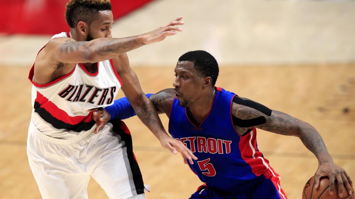 Pistons guard Kentavious Caldwell-Pope (5) drives against Trail Blazers guard Allen Crabbe during the first half Sunday.