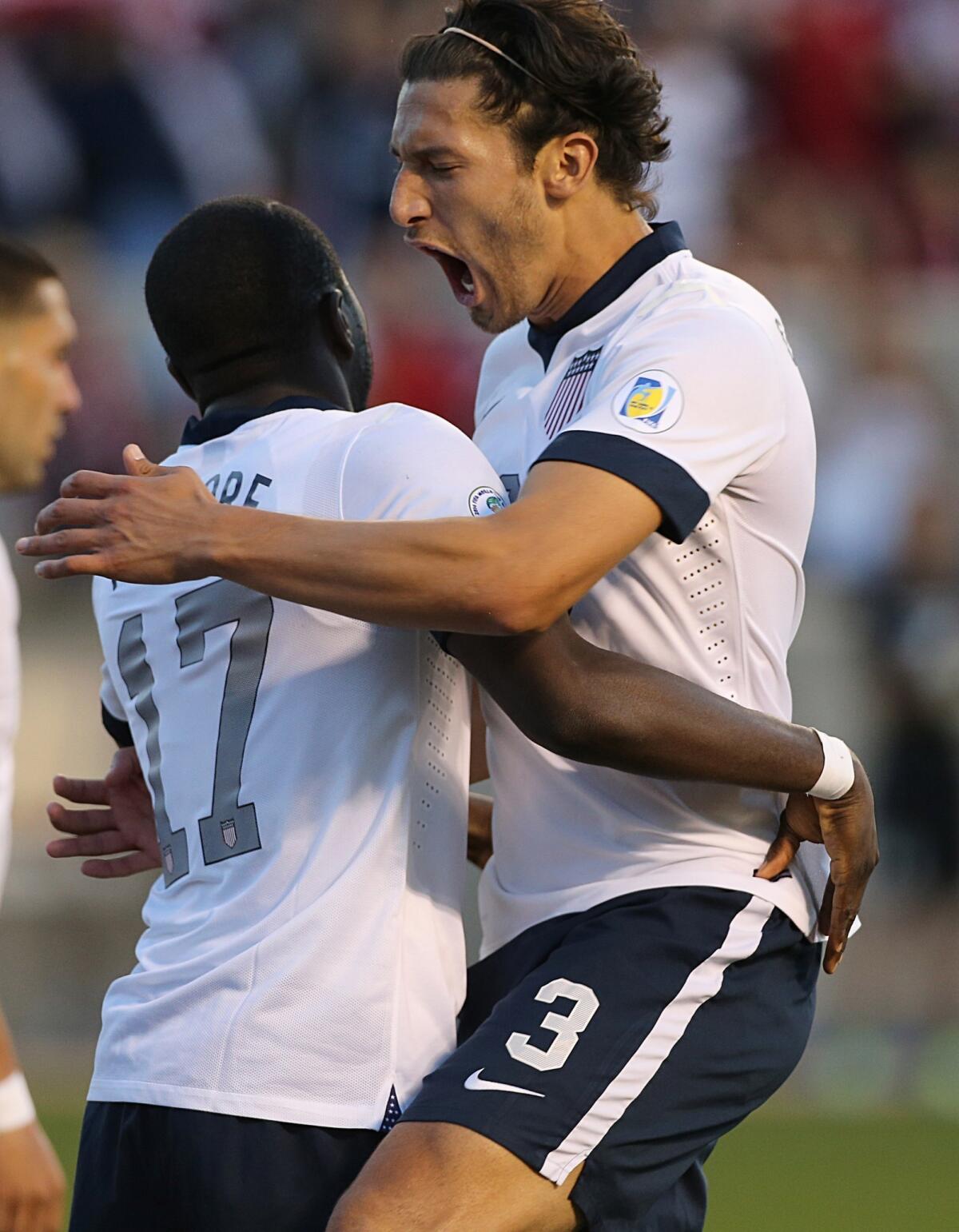 Omar Gonzalez, right, celebrates with teammate Jozy Altidore following a U.S. goal against Honduras during a World Cup qualifying match on June 18.