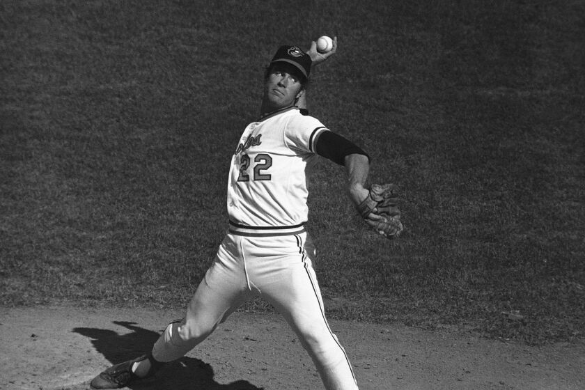 FILE - Baltimore pitcher Jim Palmer (22) delivers during a World Series game, Monday, Oct. 11, 1971, in Baltimore, Md. Palmer pitched 25 complete games in 1975. The entire major leagues have combined for 35 this year, down from 50 last season and 622 in 1988. (AP Photo/File)