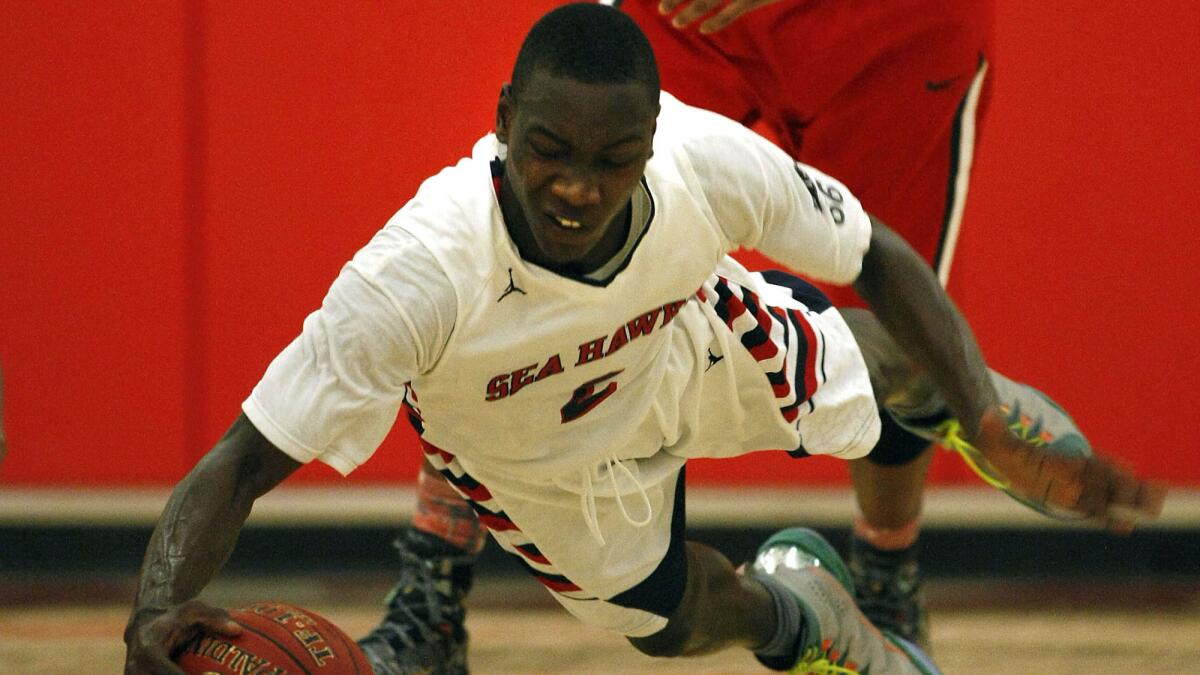 Redondo guard Leland Green dives after a loose ball during a playoff game against Westchester on March 18, 2014.
