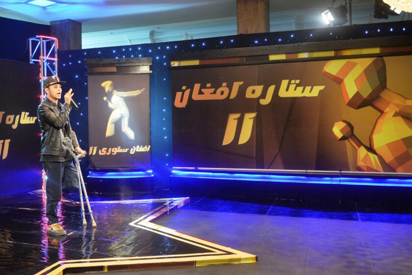 Contestant Farid Taqid, 19, tries out for "Afghan Star," a singing competition TV show in Afghanistan.